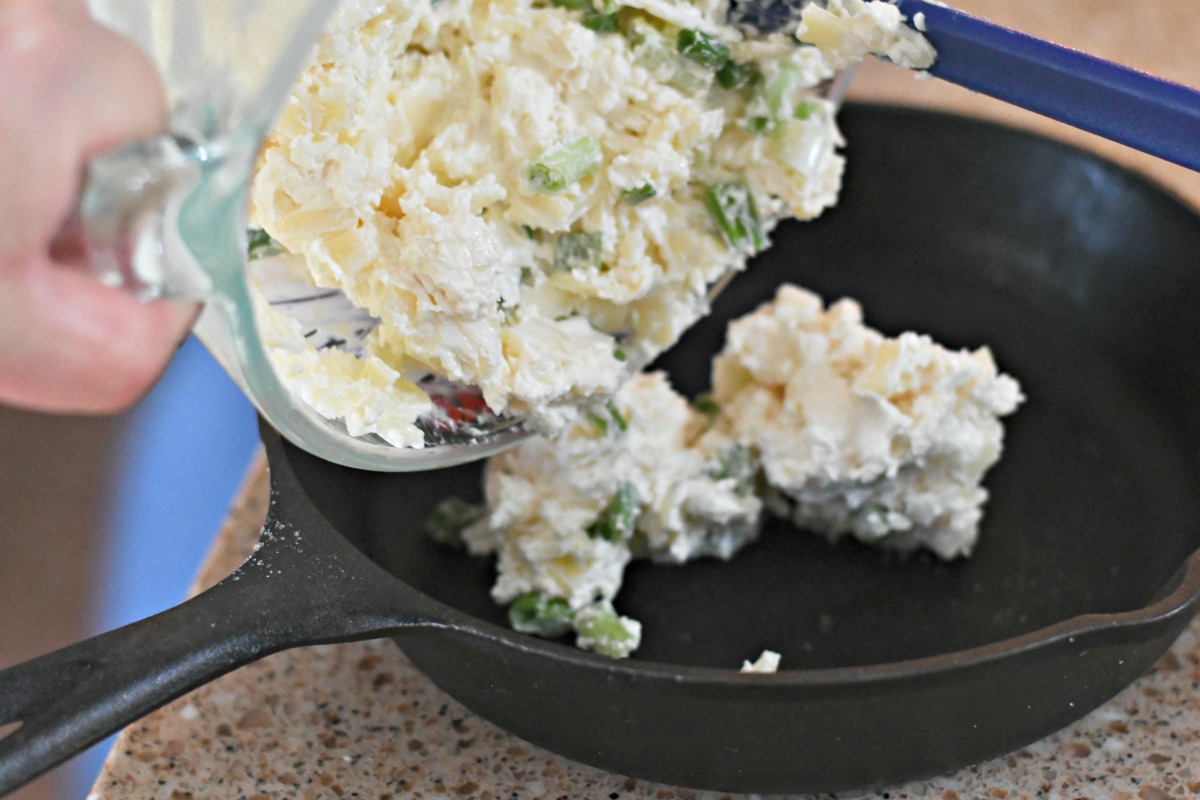 6-ingredient Swiss cheese bacon dip &ndash; scraping the dip ingredients into a pan