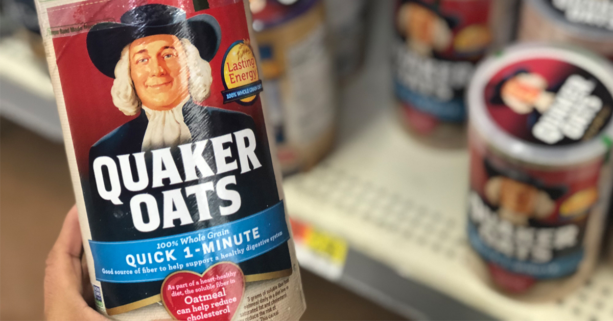 hand holding quaker oats in store