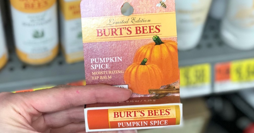 hand holding up burt's bees lip balm