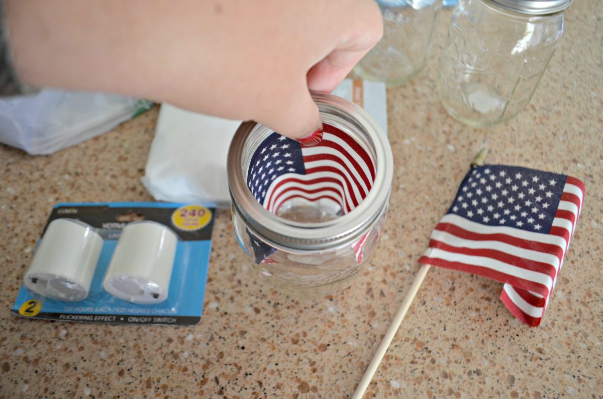 Dollar Tree 4th of July Craft Mason Jar Votives &ndash; using mini flags as a backdrop
