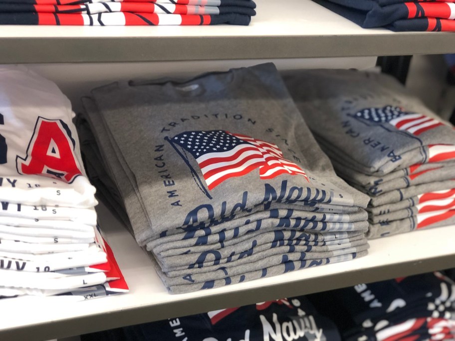 old navy flag tees on shelf in store