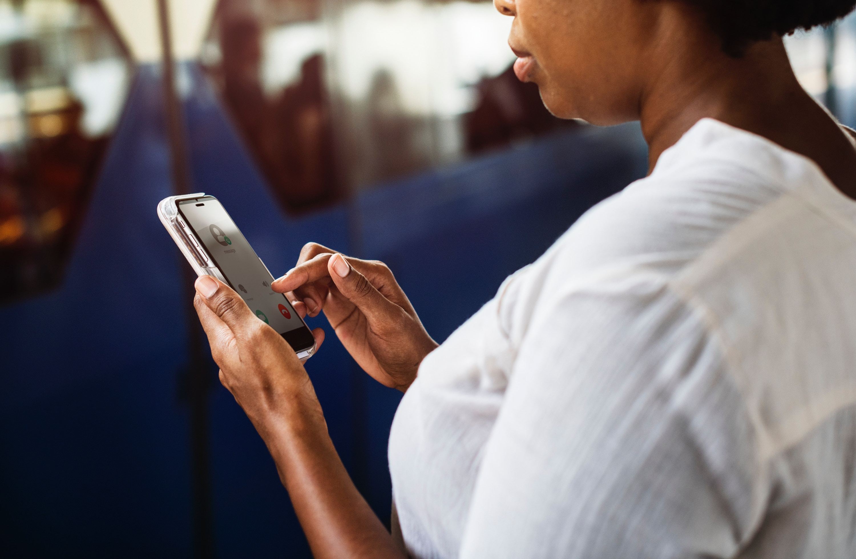 stop unwanted spam phone calls &ndash; woman considering whether to answer the phone