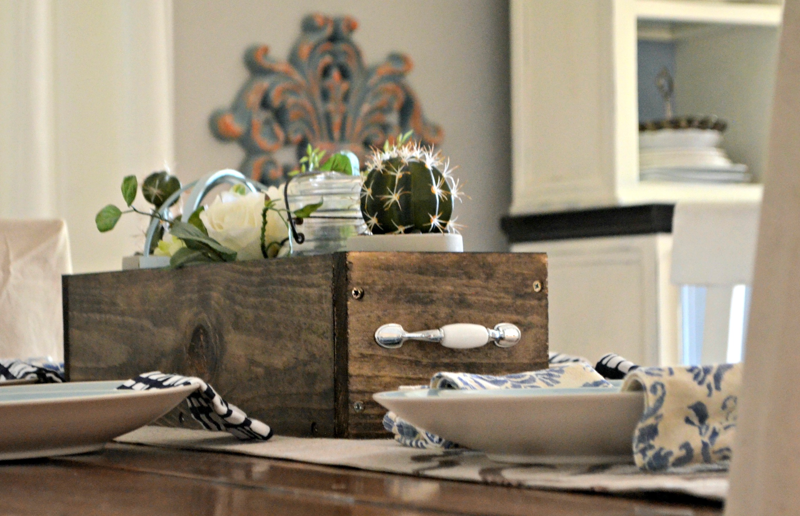 diy rustic farmhouse wood box centerpiece &ndash; filled with cute items like cacti, a vase, and a candle