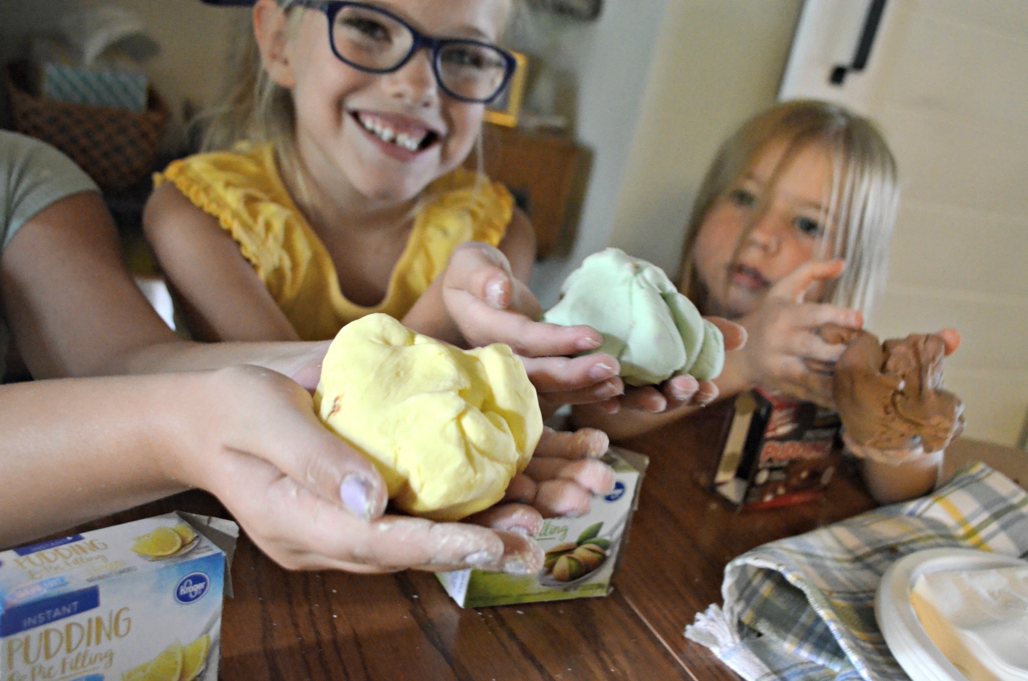DIY play dough Pudding Slime &ndash; kids holding the slime in their hands