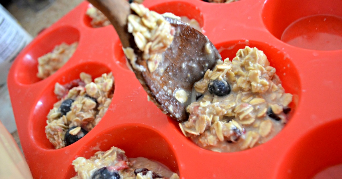Baked Oatmeal Berry Cups &ndash; Spooning the batter into a cupcake pan