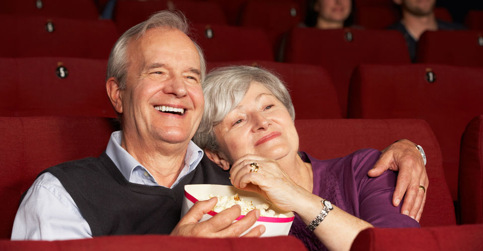 Stores, restaurants, hotels, and other places that offer senior discounts &ndash; couple watching a movie