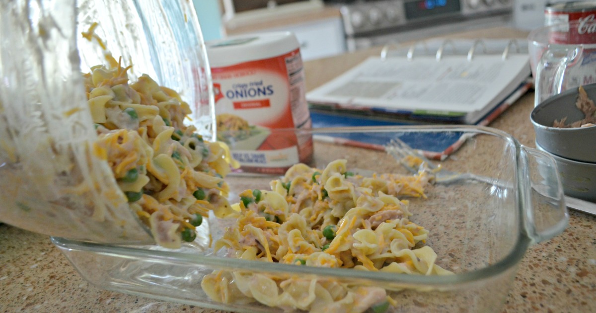 tuna noodle casserole is one of our favorite childhood recipes &ndash; Here, pouring ingredients into the baking dish