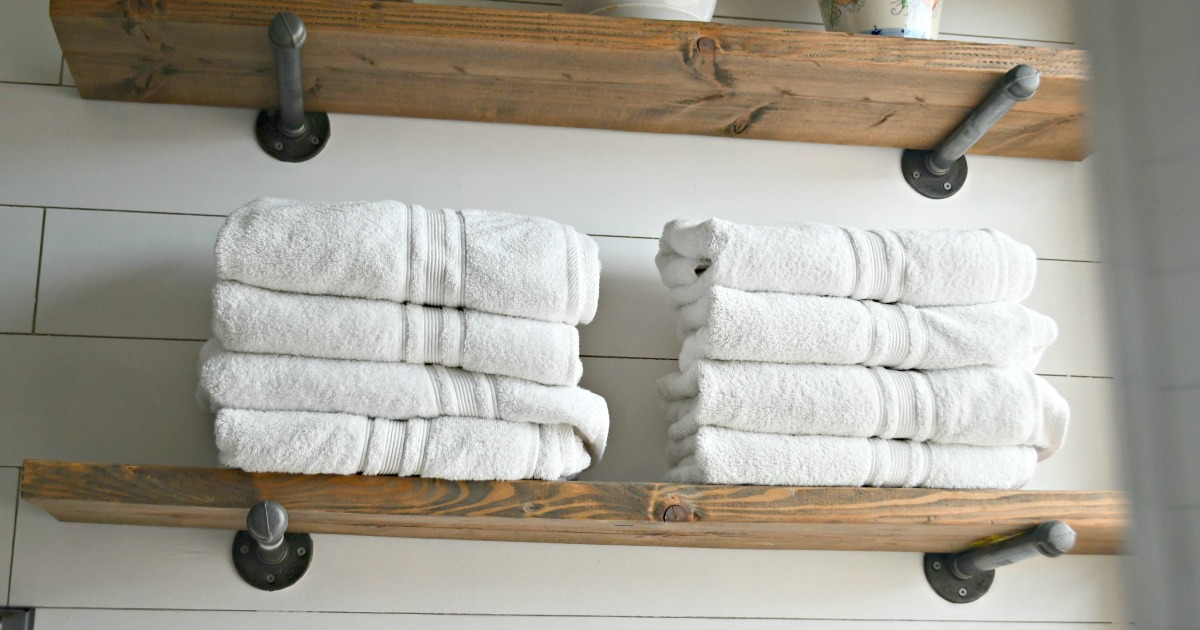 Costco Charisma Bath Towels Are Affordable & High-Quality &ndash; Stacked in a bathroom on shelves
