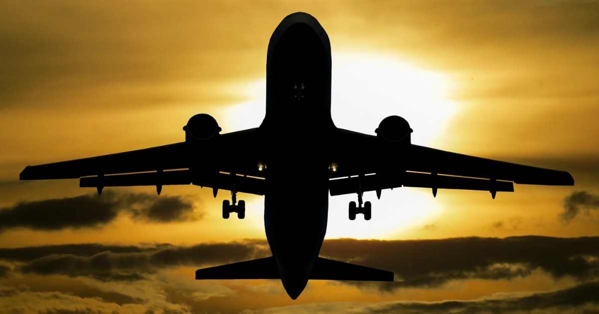 domestic airlines lawsuit settlement &ndash; a plane flying into the sunset