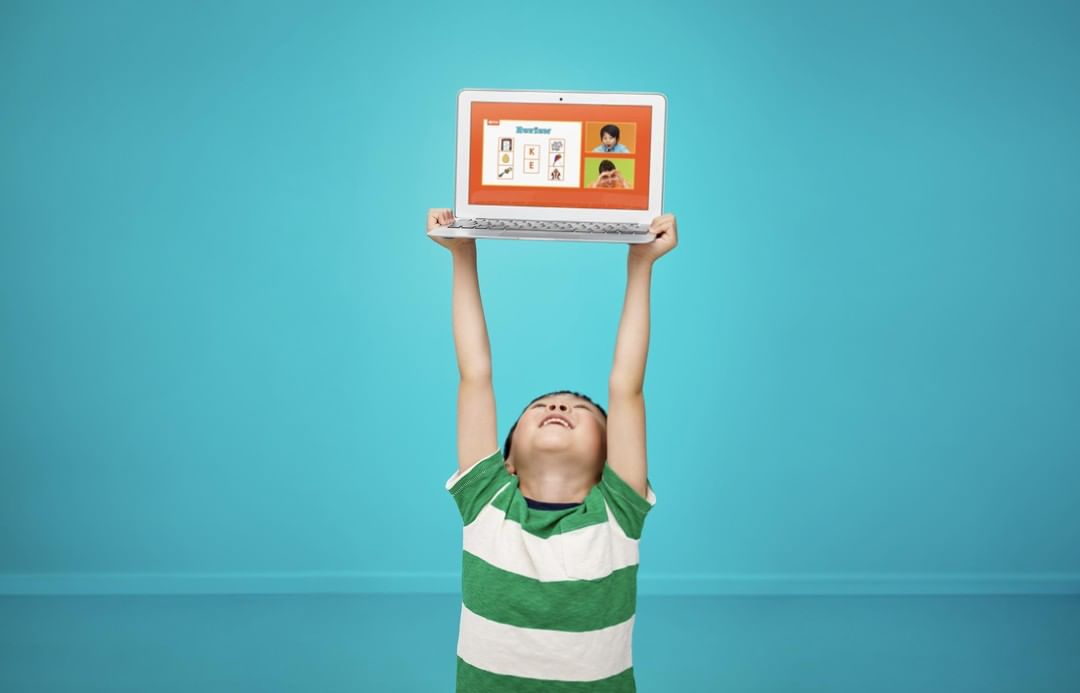 earn from home! vipkid is hiring teachers &ndash; Student holding up a laptop
