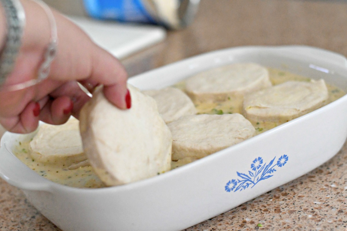 adding biscuits before baking to the broccoli cheddar cobbler