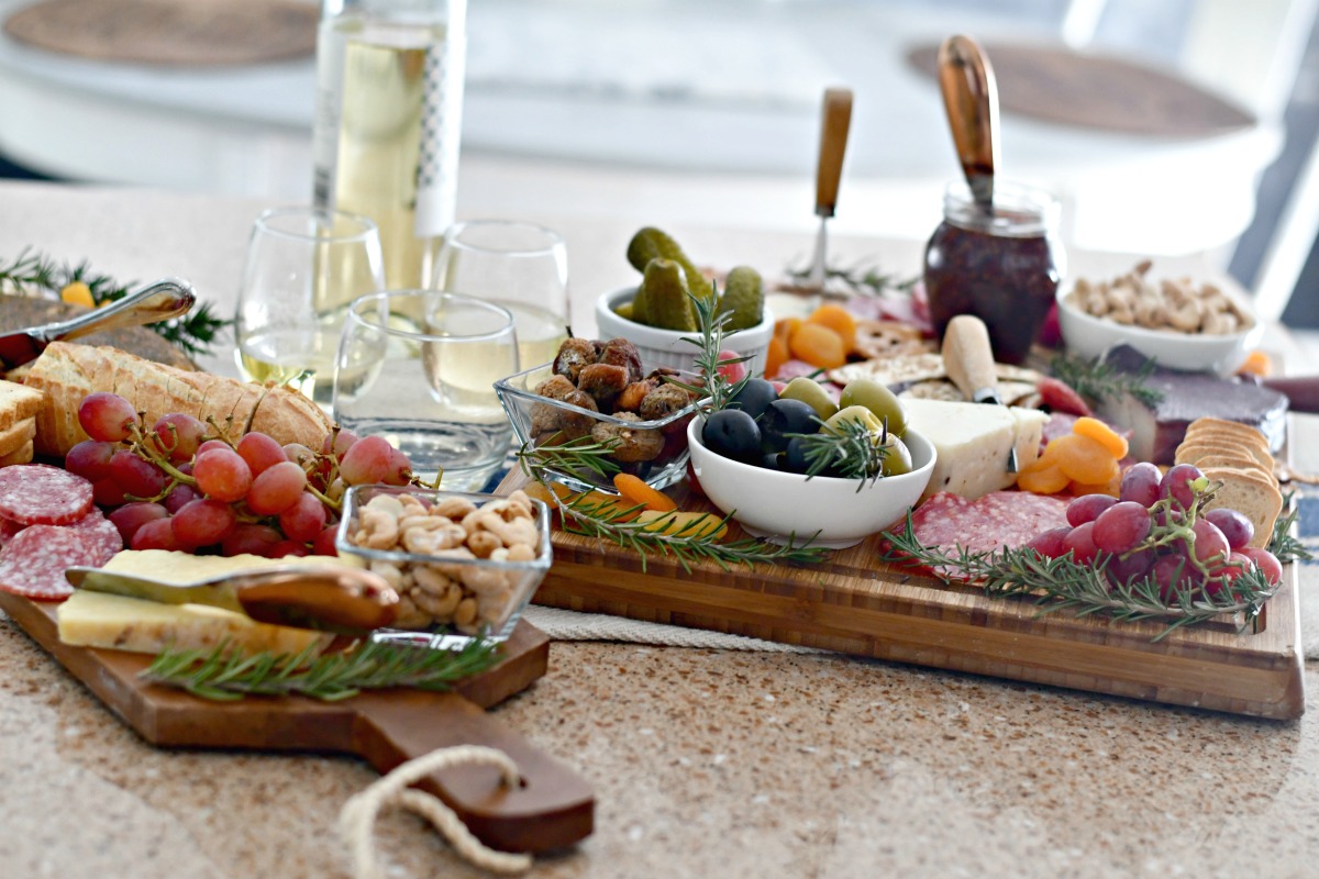 best easy charcuterie board &ndash; two trays nuts, dried fruit, jam, cheese, olives, meat, and cheese