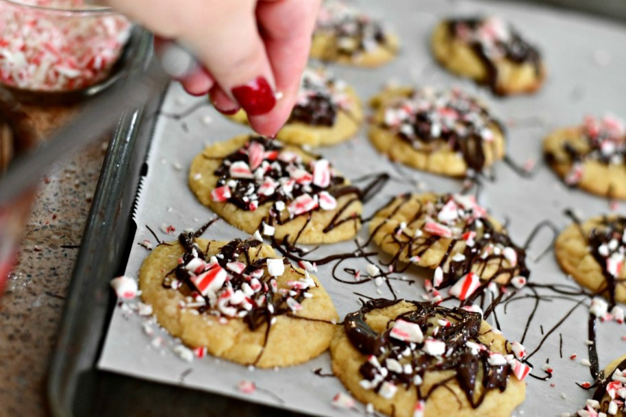 cookie dough christmas cookies recipe &ndash; peppermint chocolate drizzle cookies on a cookie sheet