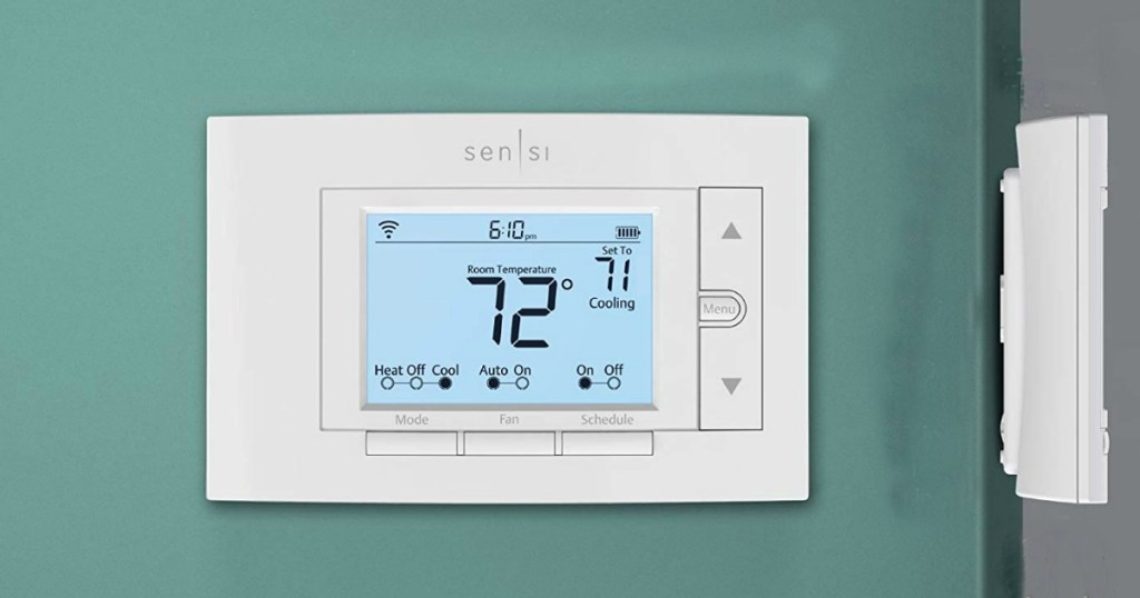 sensi smart thermostat on a green wall
