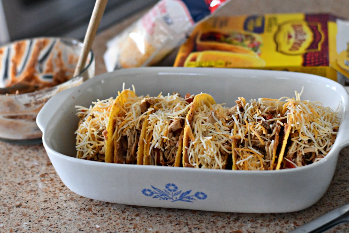 Slow Cooker Chicken Tacos - in shells in a baking dish