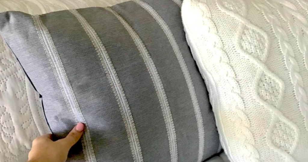 grabbing navy striped throw pillow