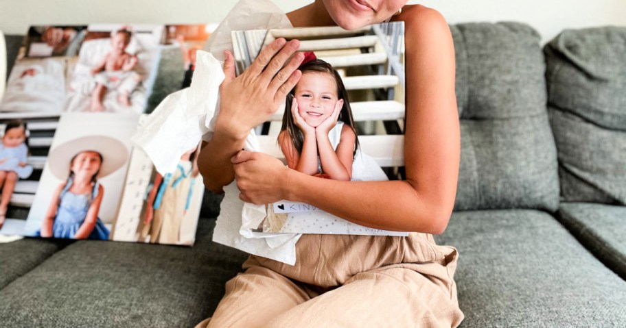 woman hugging a canvas print