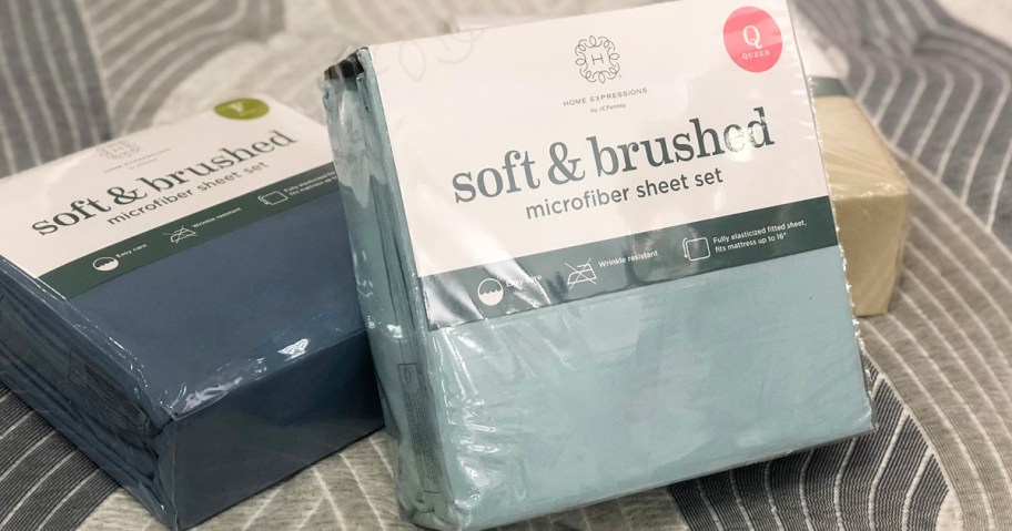 three bed sheet packages on bed