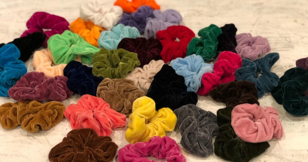 huge pile of velvet scrunchies laying next to each other