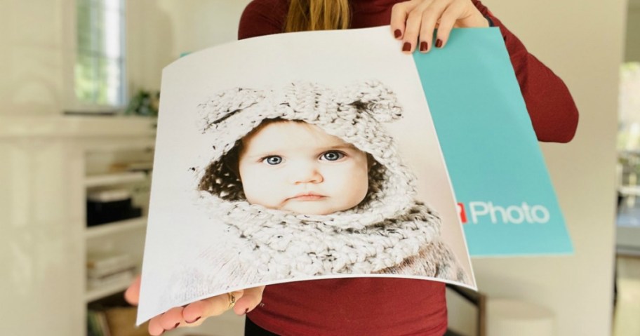 woman holding a photo print