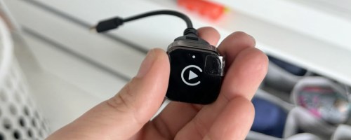 iGENJUN Wireless CarPlay Adapter in hand