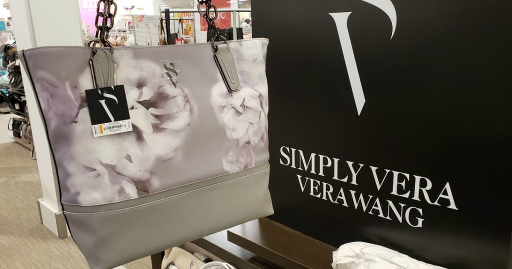 vera wang purse in front of Vera Wang sign