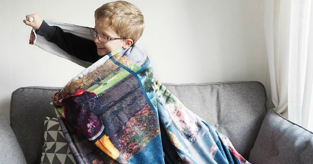 Young boy wrapped in a personalized photo blanket