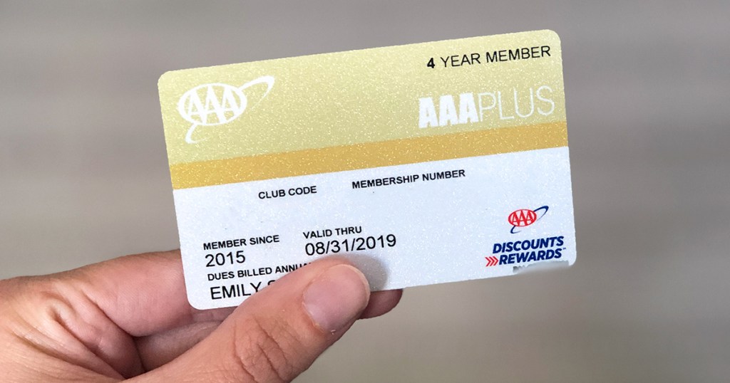 holding up triple a (aaa) membership card