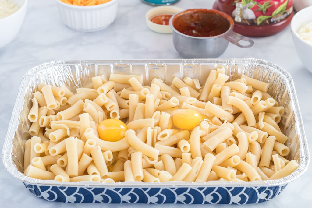 adding egg to pasta
