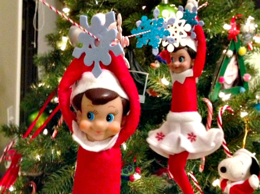 ziplining elves on a christmas tree