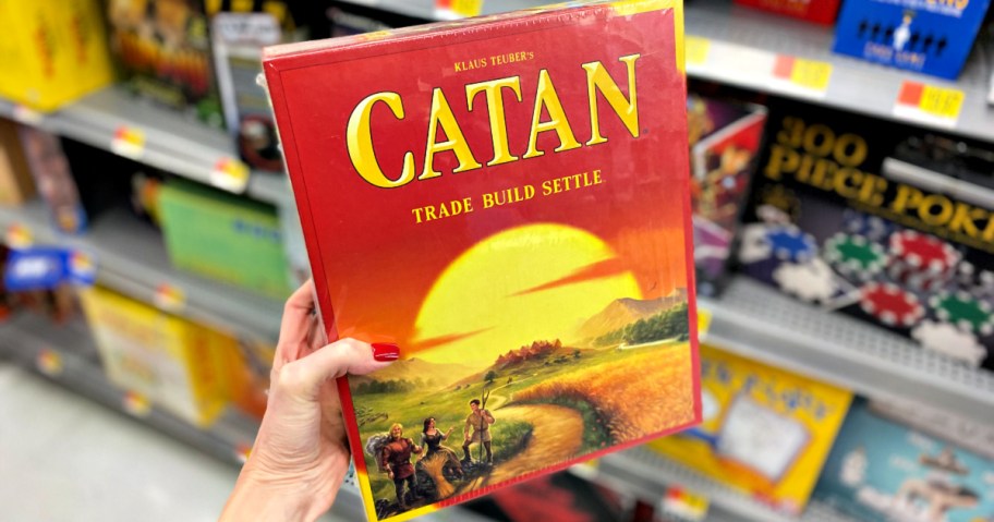 hand holding Catan Board Game