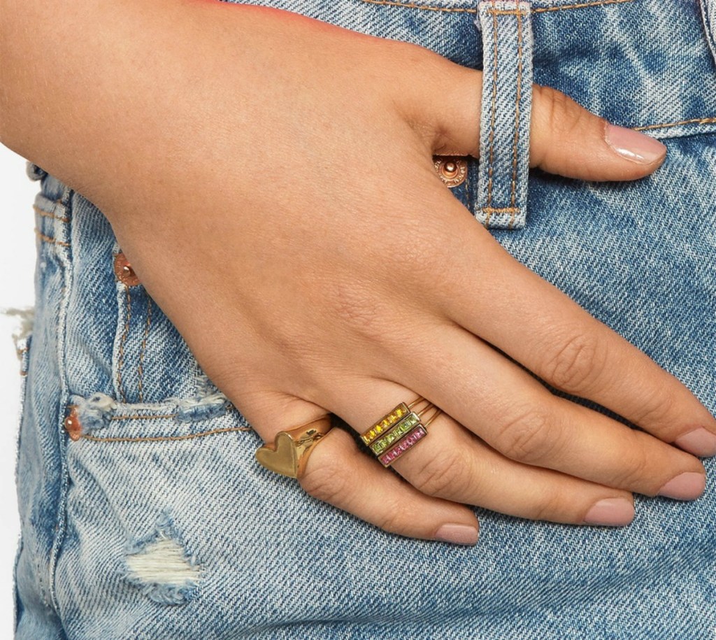 woman wearing multicolored gemstone ring