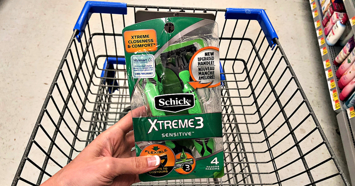 Schick Xtreme 3 Sensitive Razors in hand in front of Walgreens shopping cart