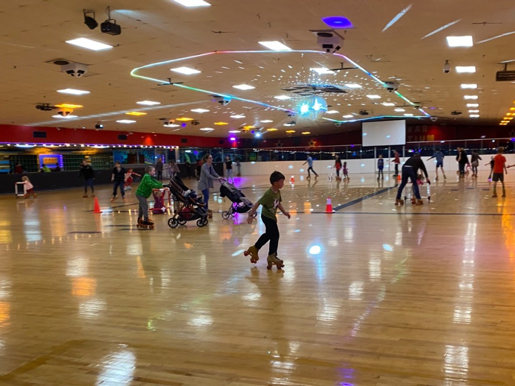 kids roller skating at an indoor rink