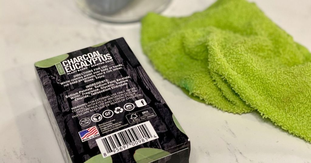 Shugar Soapworks box with ingredients listed on a counter next to a towel