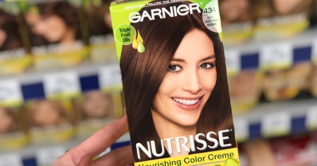 hand holding a box of hair color