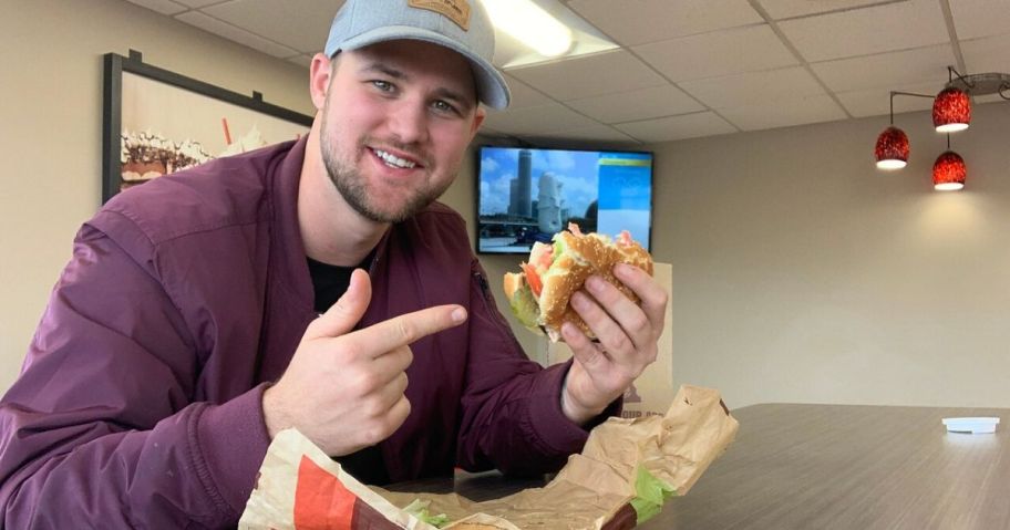 man eating whopper at Burger King