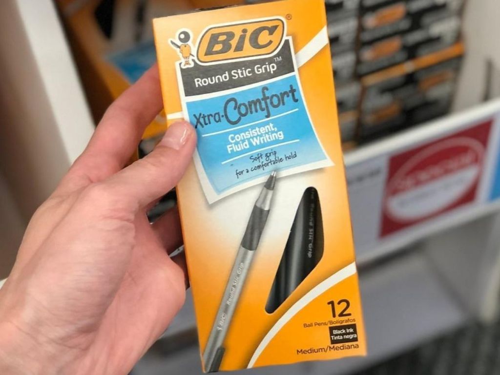 box of 12 pens in woman's hand