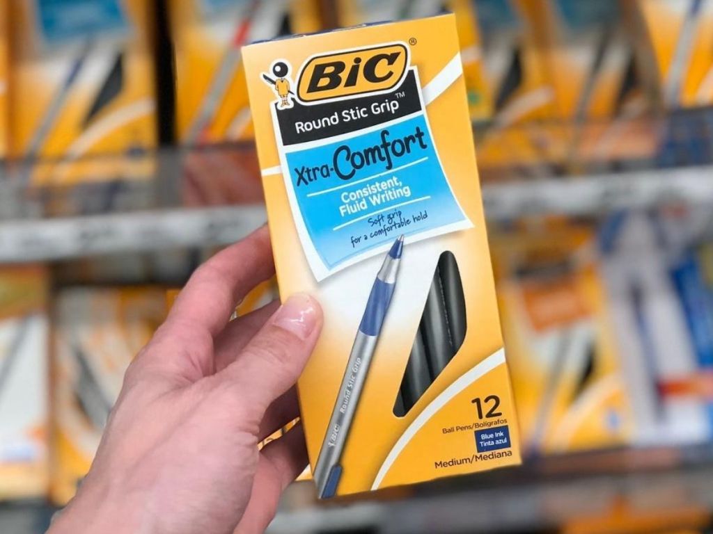 box of 12 pens in woman's hand