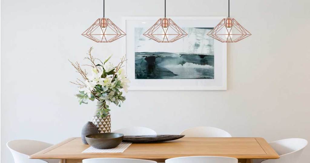 three pendant lights in a dining room