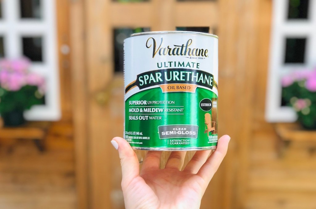hand holding a can of spar urethane stain 