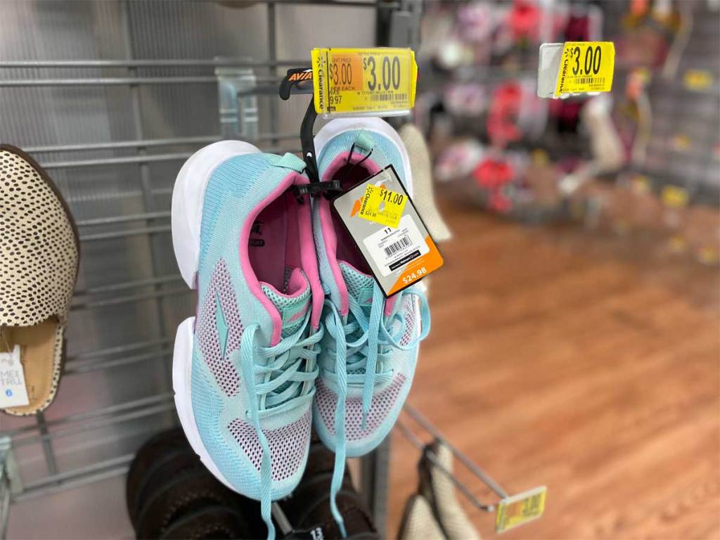women's tennis shoes hanging on display