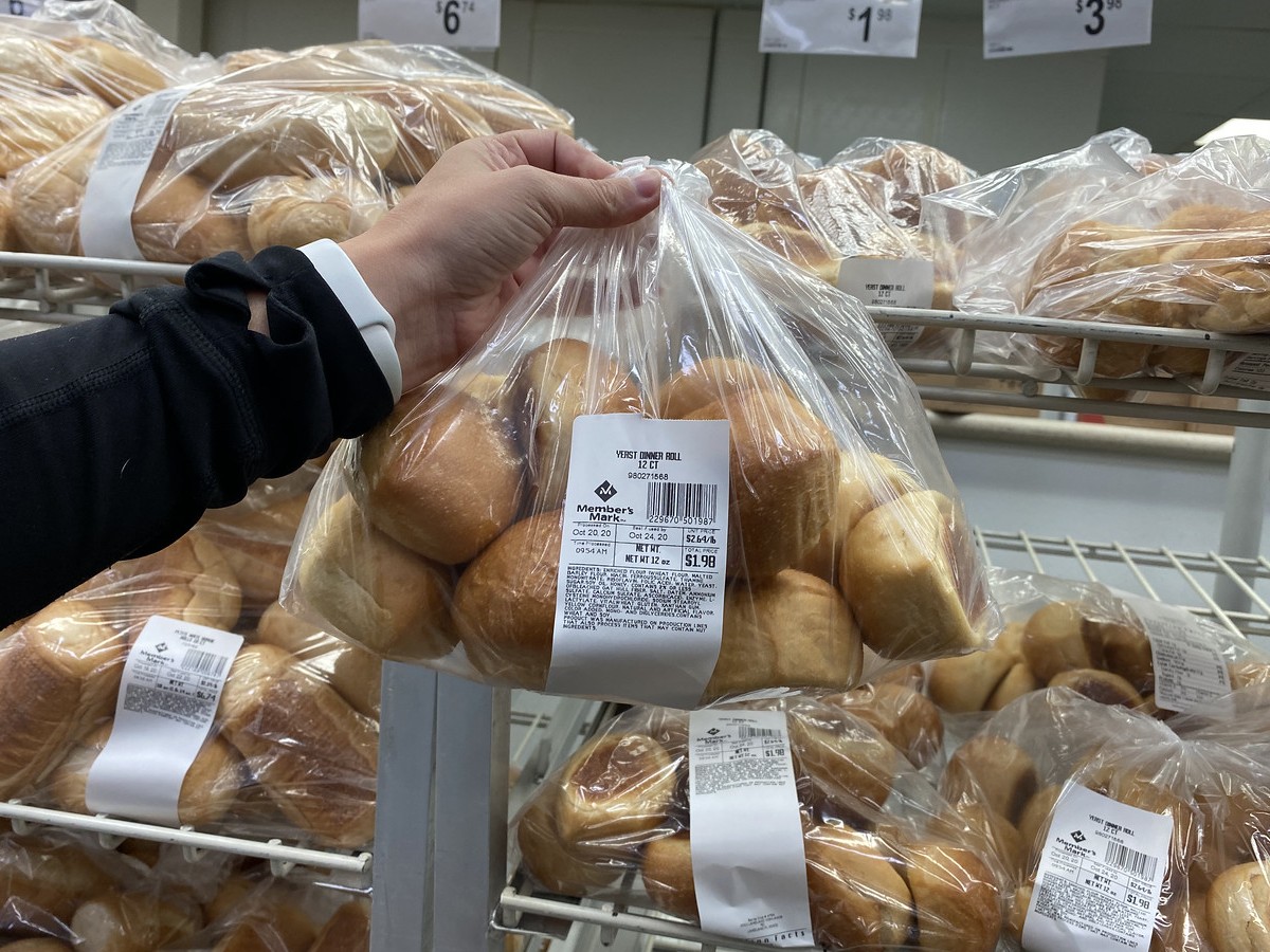 holding bag of Yeast Rolls at Sam's Club