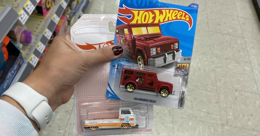 hand holding Hot Wheels Cars from Walgreens