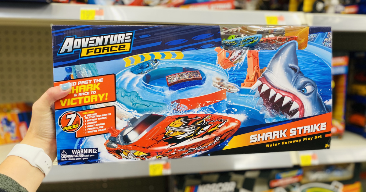 hand holding Adventure Force Shark Strike Water Raceway Play Set box