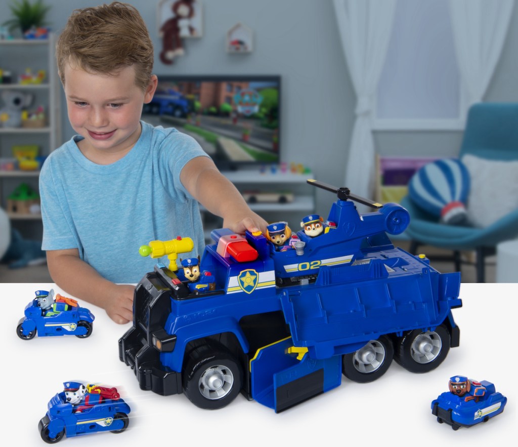 boy playing with PAW Patrol Chase&rsquo;s 5-in-1 Ultimate Cruiser with Lights and Sounds