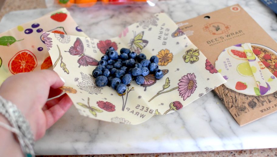 hand holding corner of bees wraps reusable food wrap