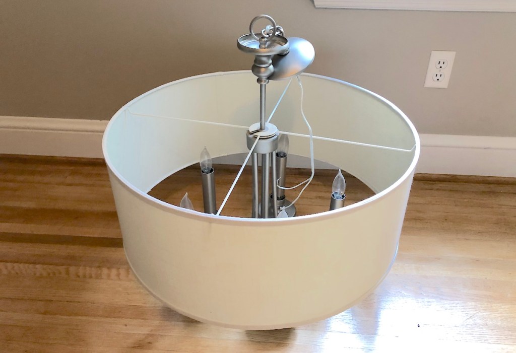 large drum shaped lighting fixture sitting on wood floor home decor ideas