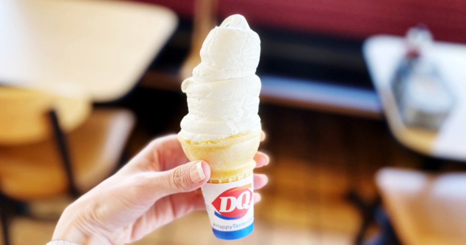 hand holding a vanilla cone