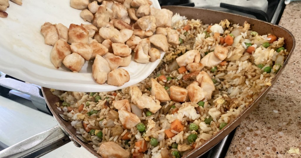 adding chicken to chicken fried rice